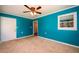 Spacious bedroom with carpet, a ceiling fan and an access door at 780 Navajo Trl, Covington, GA 30016