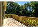 Wooden deck with view of private backyard and trees at 780 Navajo Trl, Covington, GA 30016