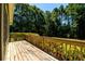 Wooden deck overlooking a wooded backyard at 780 Navajo Trl, Covington, GA 30016