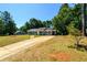 Nice curb appeal, long driveway, and spacious yard at 780 Navajo Trl, Covington, GA 30016