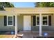 Newly painted front door with white columns at 780 Navajo Trl, Covington, GA 30016