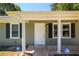 Inviting front porch with updated door and classic columns at 780 Navajo Trl, Covington, GA 30016