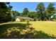 Ranch home with a large front yard and mature trees at 780 Navajo Trl, Covington, GA 30016