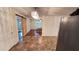 Open-concept kitchen and dining area with barn door and modern lighting fixture at 780 Navajo Trl, Covington, GA 30016