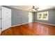 Living room with hardwood floors and ceiling fan at 780 Navajo Trl, Covington, GA 30016