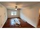 Living room featuring a fan, hardwood floors, and natural light at 780 Navajo Trl, Covington, GA 30016