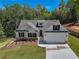Two story home with a white exterior and gray roof at 105 Eryn Ter, Covington, GA 30014