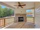 Covered back porch with fireplace and wooden deck at 105 Eryn Ter, Covington, GA 30014