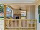 Wooden deck and railing with brick fireplace and ceiling fan at 105 Eryn Ter, Covington, GA 30014