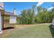 Landscaped backyard with a view of the woods at 105 Eryn Ter, Covington, GA 30014