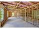 Unfinished basement with framed walls and pink insulation at 105 Eryn Ter, Covington, GA 30014