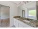 Bathroom with granite countertops and double vanity at 105 Eryn Ter, Covington, GA 30014