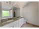 Bathroom with granite countertops and double vanity at 105 Eryn Ter, Covington, GA 30014
