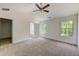 Spacious bedroom with ceiling fan and large windows at 105 Eryn Ter, Covington, GA 30014