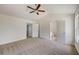 Spacious bedroom with ceiling fan and access to bathroom at 105 Eryn Ter, Covington, GA 30014
