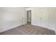 Well-lit bedroom with double doors and carpet flooring at 105 Eryn Ter, Covington, GA 30014