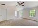 Spacious bedroom with ceiling fan and large windows at 105 Eryn Ter, Covington, GA 30014