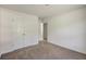 Spacious bedroom with double doors and carpet flooring at 105 Eryn Ter, Covington, GA 30014