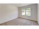 Simple bedroom with window and carpet flooring at 105 Eryn Ter, Covington, GA 30014