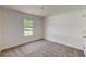 Bright bedroom with neutral walls and carpeted floor at 105 Eryn Ter, Covington, GA 30014