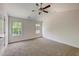 Bright bedroom with ceiling fan and large windows at 105 Eryn Ter, Covington, GA 30014
