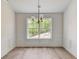 Bright dining room with hardwood floors and chandelier at 105 Eryn Ter, Covington, GA 30014