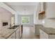 Bright kitchen with granite countertops and white cabinets at 105 Eryn Ter, Covington, GA 30014