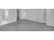 Neutral bedroom featuring plush carpet, a large entryway, and a closet door at 1125 Blackshear Dr, Decatur, GA 30033