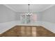 Charming dining room with hardwood floors, wainscoting, and ample natural light at 1125 Blackshear Dr, Decatur, GA 30033