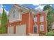 Charming brick home with a two-car garage and manicured landscaping at 1125 Blackshear Dr, Decatur, GA 30033