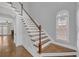 Elegant foyer showcasing hardwood floors, a staircase, and lots of natural light at 1125 Blackshear Dr, Decatur, GA 30033