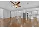 Spacious living room with hardwood floors, elegant columns, and modern ceiling fan at 1125 Blackshear Dr, Decatur, GA 30033