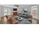 Comfortable living room featuring a brick fireplace and lots of natural light at 1125 Blackshear Dr, Decatur, GA 30033