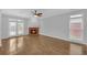 Bright living room featuring hardwood floors, a brick fireplace, and a glass door at 1125 Blackshear Dr, Decatur, GA 30033