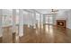 Spacious living room featuring hardwood floors, fireplace, and modern lighting at 1125 Blackshear Dr, Decatur, GA 30033