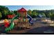 Vibrant playground with colorful slides and play structures amid lush trees at 1125 Blackshear Dr, Decatur, GA 30033