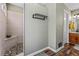 Walk-in shower with mosaic tiled floors, built-in bench, plus adjacent vanity at 380 Stone Rd, Mcdonough, GA 30253