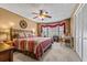 Relaxing bedroom featuring a decorative ceiling fan and bay windows with window treatments at 380 Stone Rd, Mcdonough, GA 30253