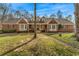 Charming brick home boasts a manicured lawn, mature trees, and classic curb appeal at 380 Stone Rd, Mcdonough, GA 30253
