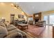 Spacious living area with vaulted ceiling, fireplace, and hardwood floors at 380 Stone Rd, Mcdonough, GA 30253