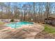 Inviting kidney-shaped pool with wooded backdrop at 380 Stone Rd, Mcdonough, GA 30253
