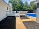 Landscaped backyard with a walkway to the pool at 4 Crestwood Rd, Cartersville, GA 30121
