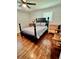 Bedroom with hardwood floors and a four-poster bed at 4 Crestwood Rd, Cartersville, GA 30121