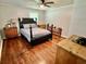 Bedroom featuring hardwood floors and a four-poster bed at 4 Crestwood Rd, Cartersville, GA 30121