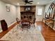 Cozy dining area featuring hardwood floors and a brick fireplace at 4 Crestwood Rd, Cartersville, GA 30121
