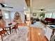 Open concept dining area with hardwood floors and brick fireplace at 4 Crestwood Rd, Cartersville, GA 30121