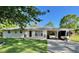 Charming single-story home featuring a covered parking area and well-maintained front lawn at 4 Crestwood Rd, Cartersville, GA 30121