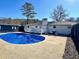 Inviting backyard with a large swimming pool, patio, a small deck, and a grill with outdoor seating at 4 Crestwood Rd, Cartersville, GA 30121