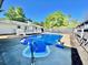 Beautiful in-ground pool in backyard, surrounded by a patio area and a wooden fence at 4 Crestwood Rd, Cartersville, GA 30121