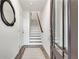 Bright entryway with staircase, wood floors, and stylish mirror at 1365 Memorial Dr # 8, Atlanta, GA 30317